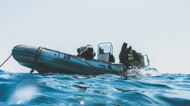 Why do scuba divers dive backwards - thumb