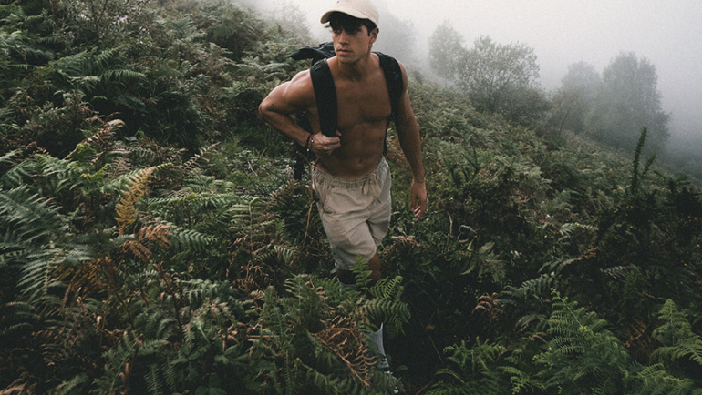 Topless hiking man