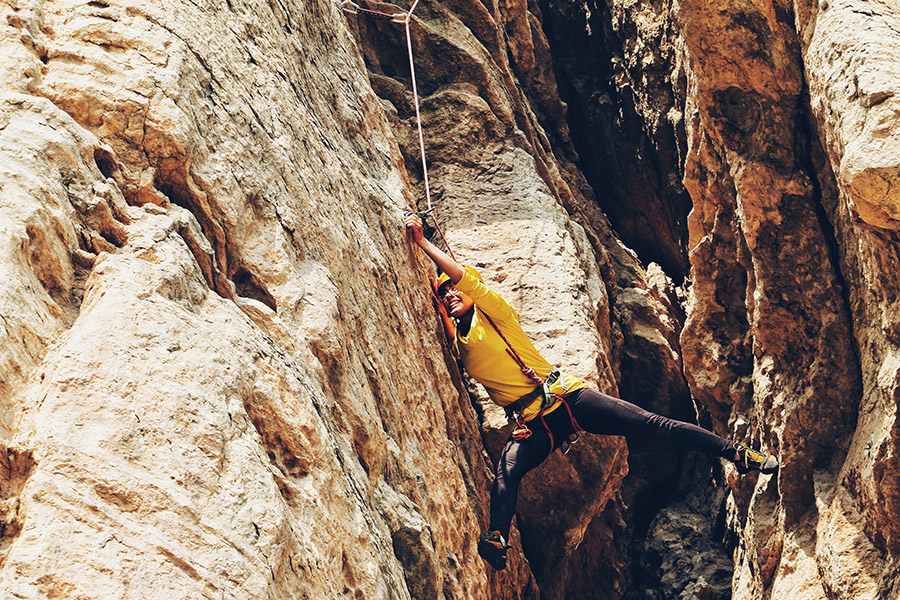 woman rock climbing