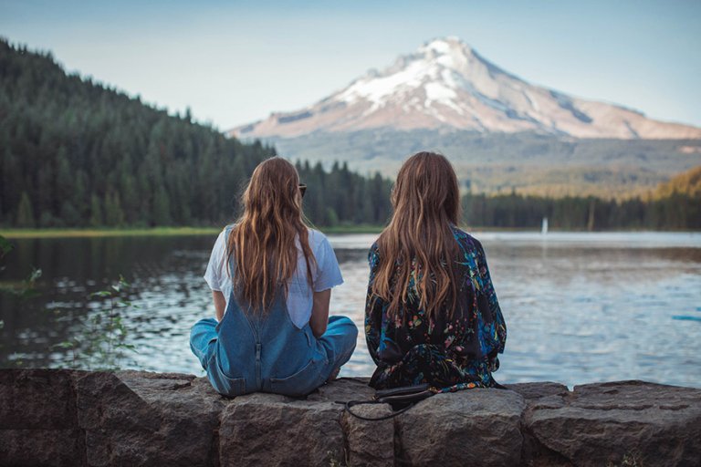 Two students watching the landscape