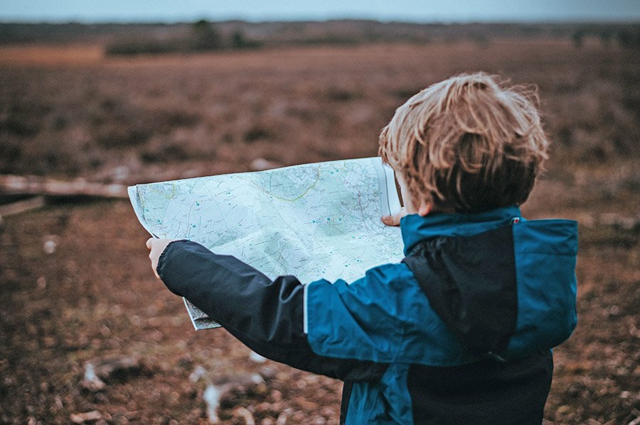 Boy looking at a map