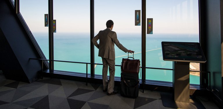 Business traveler looking at the sea