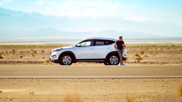 Man waiting with broken car