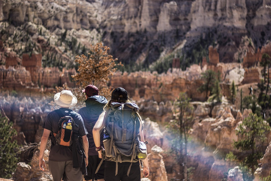 People hiking wearing hats and caps