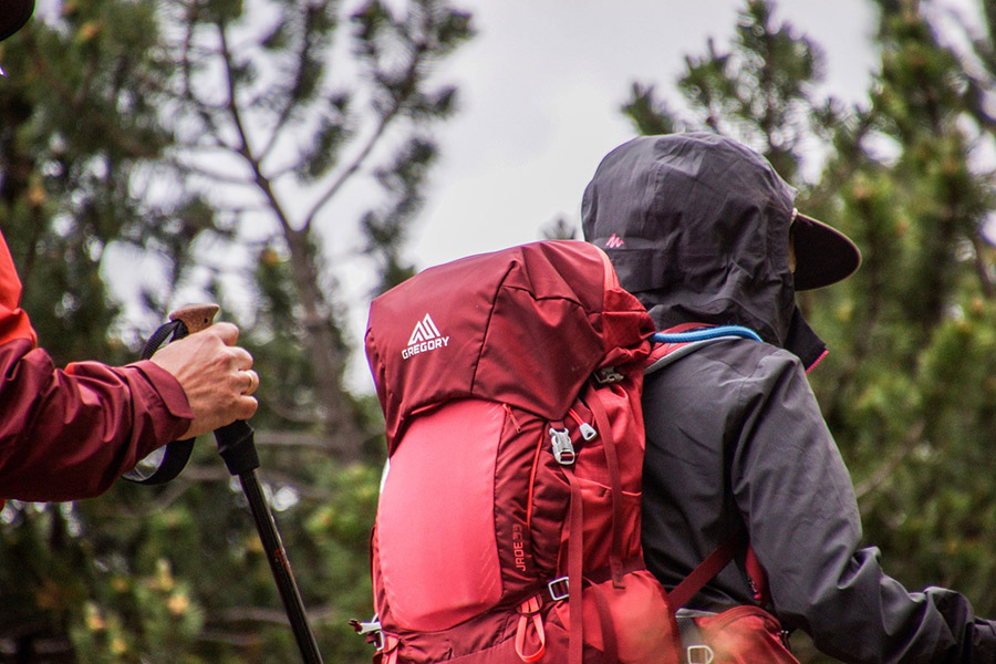 Hikers with backpack and insulating clothes