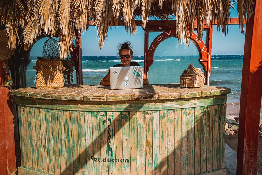 A digital nomad at a beach bar
