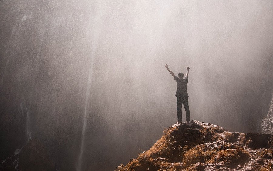 Young traveler at a waterfall