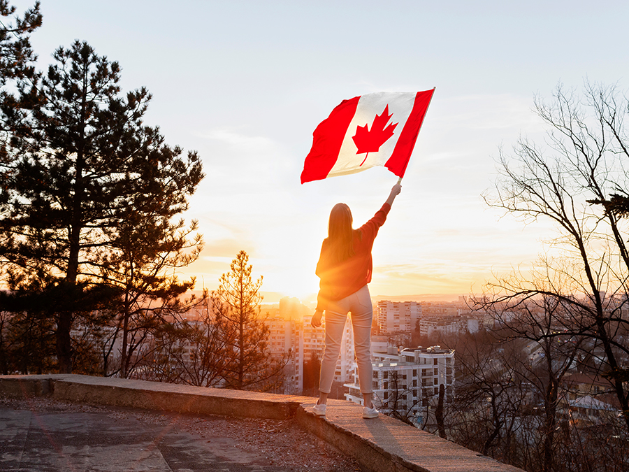 Woman holding the Canadian flag