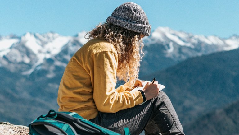 Traveler writing notes