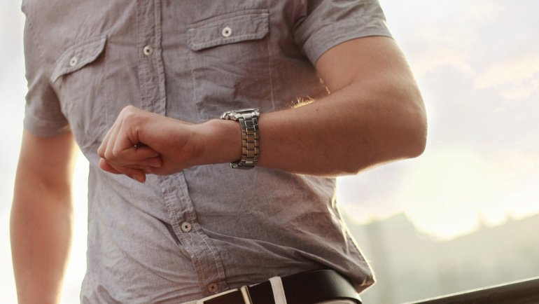 Traveler looking at his watch