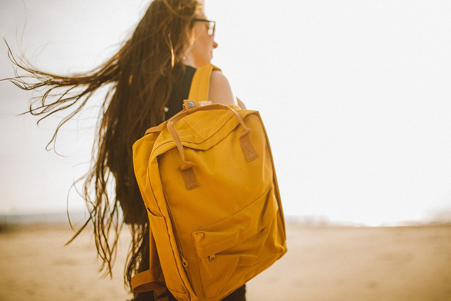 Traveler with yellow daypack