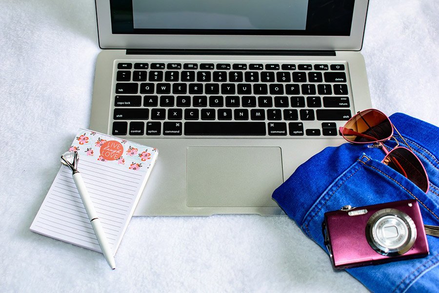 Laptop, camera and sunglasses