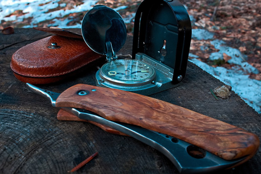 Knife and compass outdoors