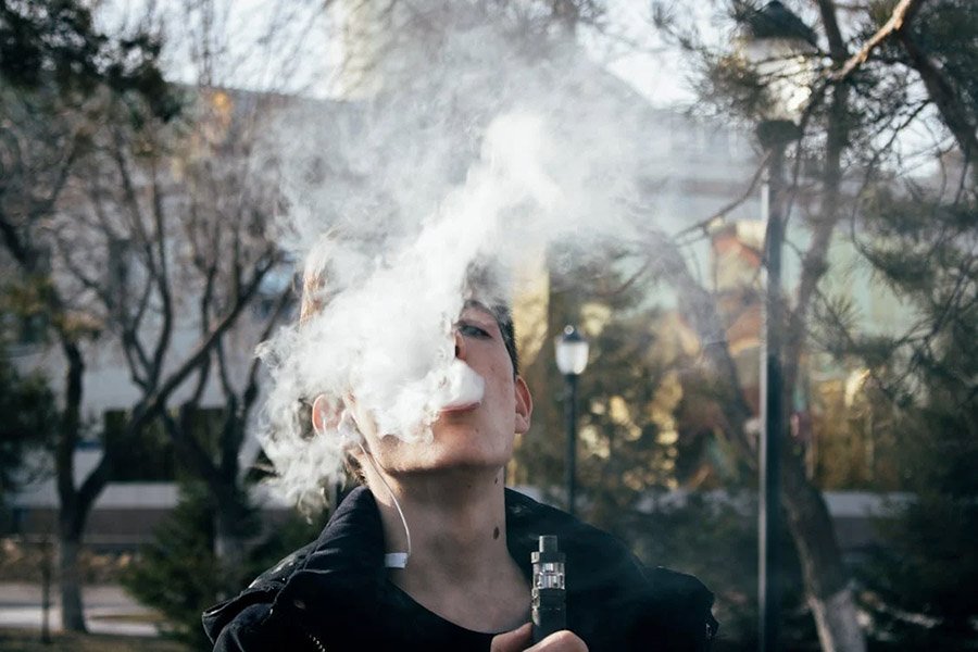 Person making smoke while vaping