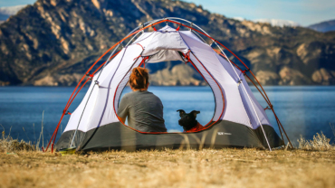 Woman and her dog in a tent