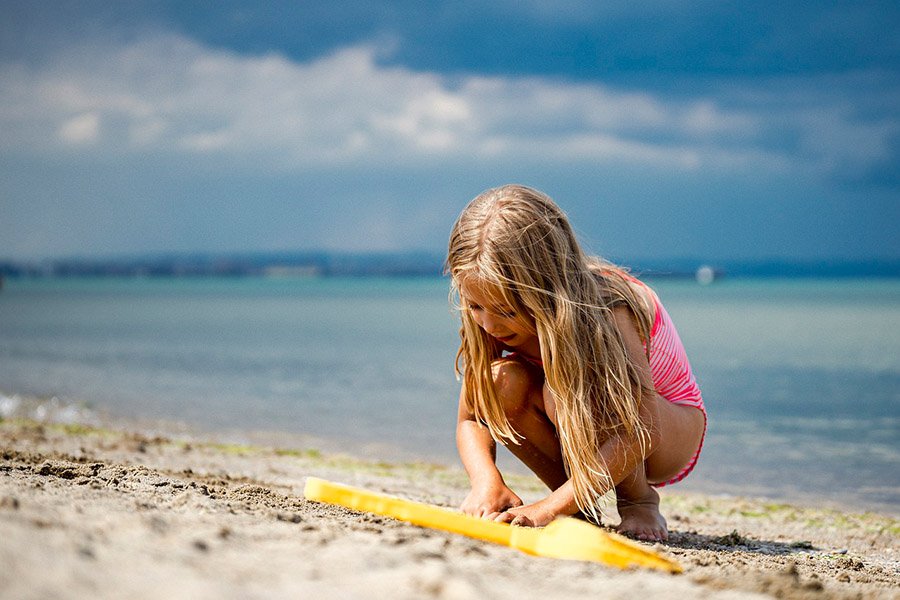 Kid playing on the beach