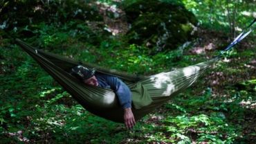 Person sleeping in a hammock