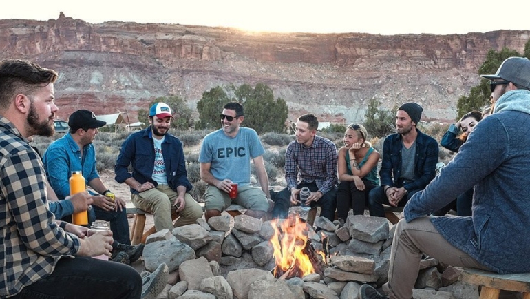 Friends having fun around the campfire