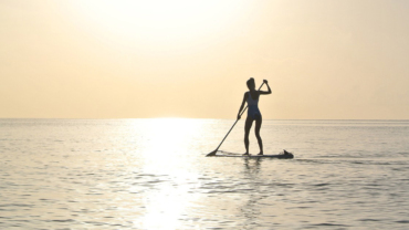 Paddle boarding at sunrise