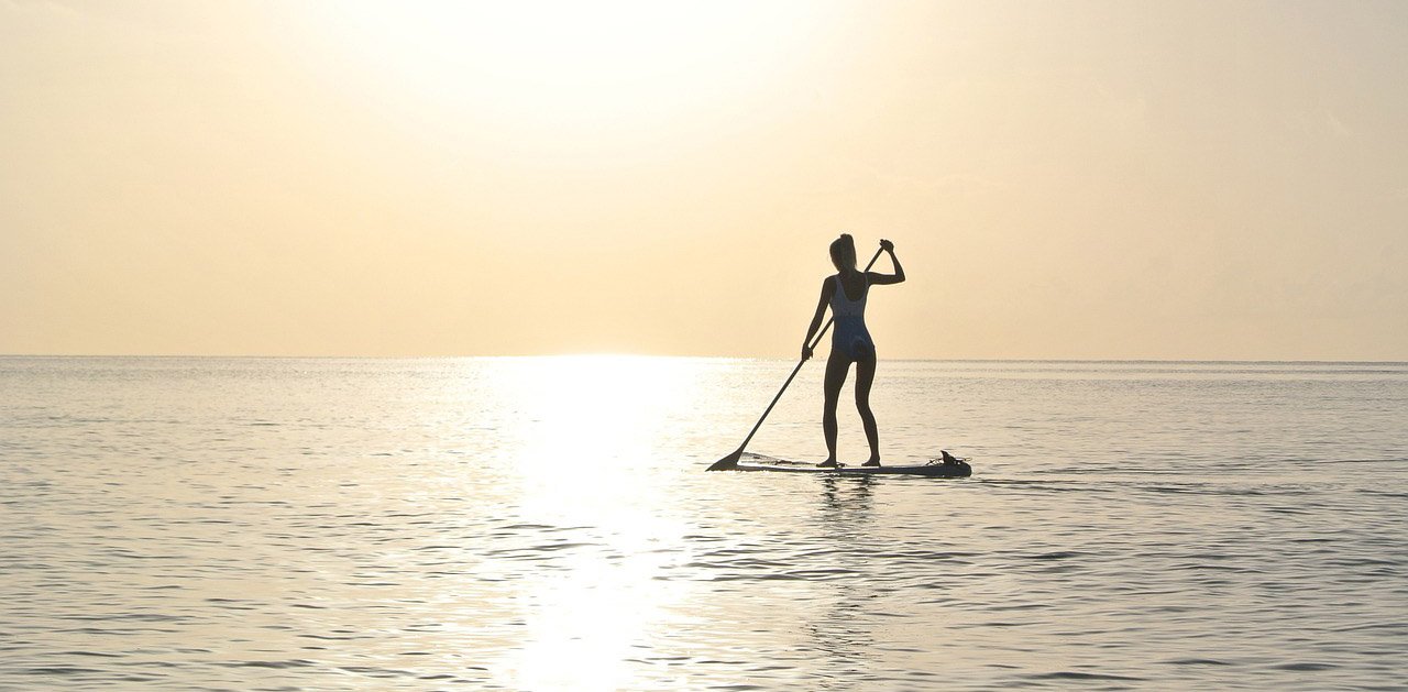 Paddle boarding at sunrise