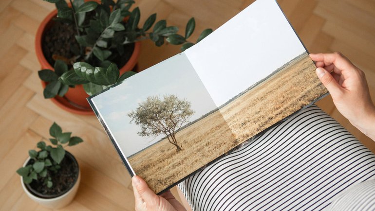 Person holding a photobook