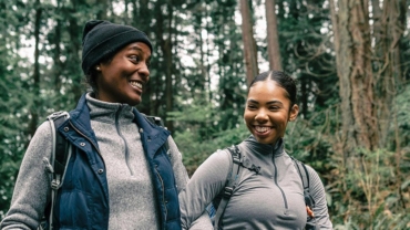 Women laughing while hiking