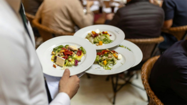 Person holding plates