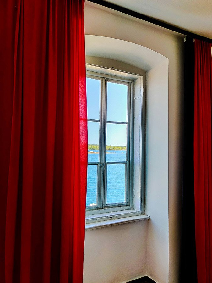 red curtains and sea view