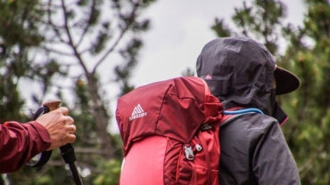 Hiker with branded gear