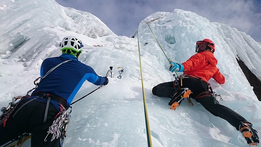 ice climbers on frozen waterfall