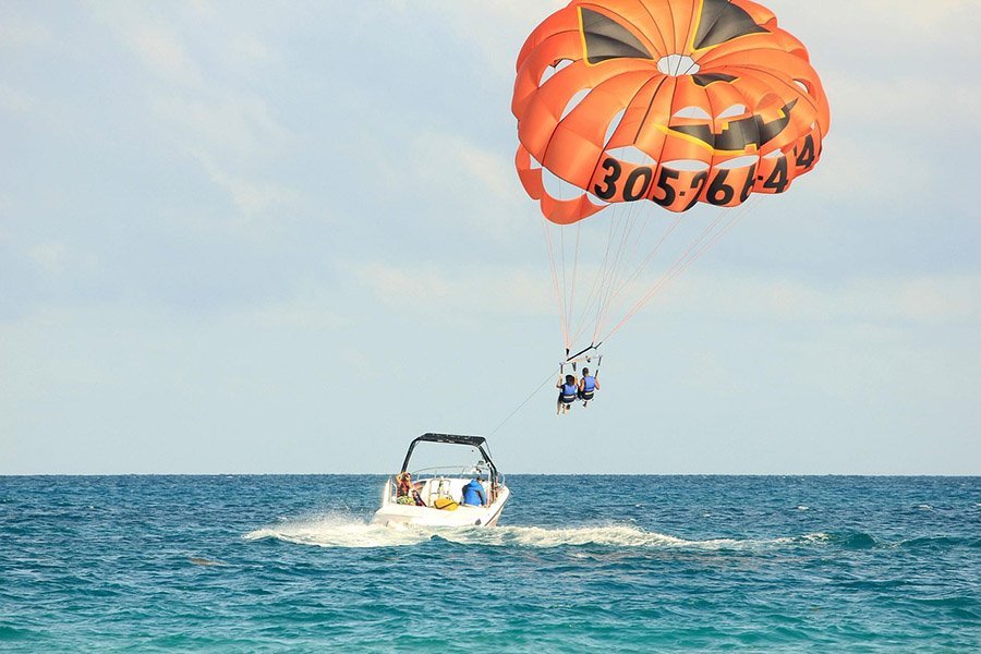 Parasailers and boat